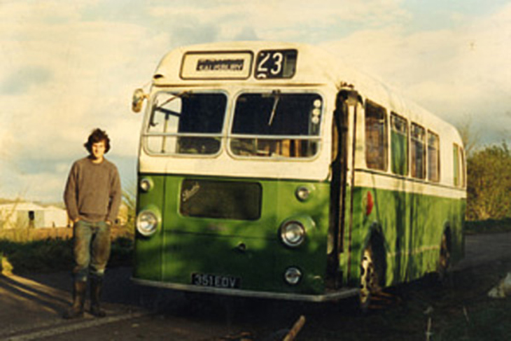 David Stooke in front of bus